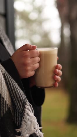 woman enjoying a latte outdoors