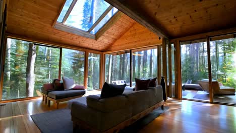 cozy modern cabin living room with forest views