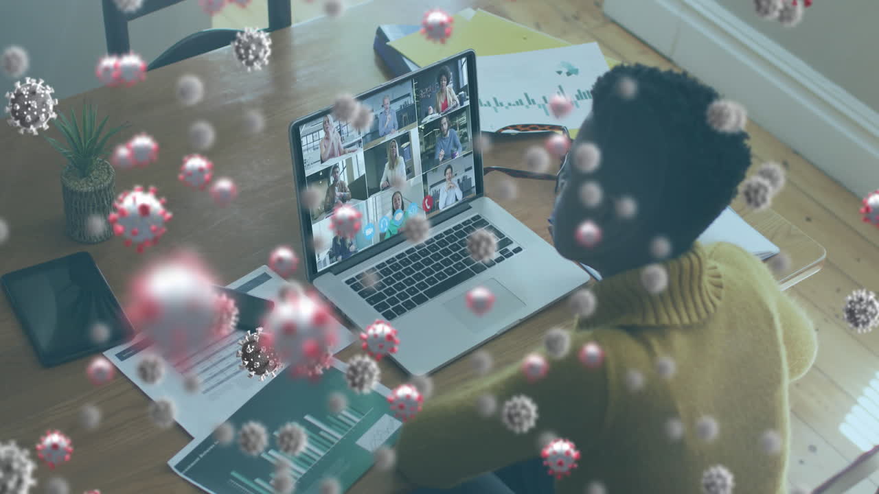 Animation of covid 19 cells over woman using laptop on video call
