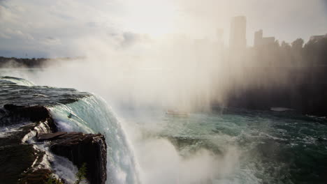 Spectacular-landscape-with-Niagara-Falls.-A-wall-of-fog-covers-the-Canadian-coast,-a-boat-is-floating-far-below-on-the-river