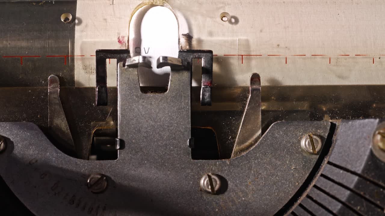 Detailed close-up showing typewriter keys striking paper as words are typed