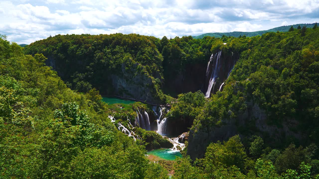 Beautiful waterfalls, emerald clear water and spring greenery in scenic Plitvice National Park, Croatia