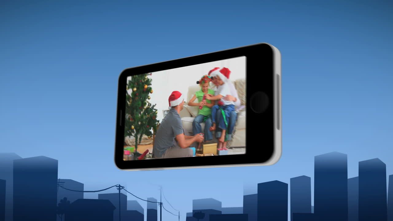 teléfono inteligente que muestra a una familia celebrando navidad