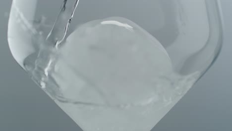 crisp water pouring over ice in glass