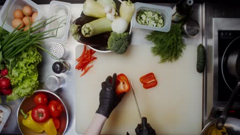 chef chopping red bell pepper