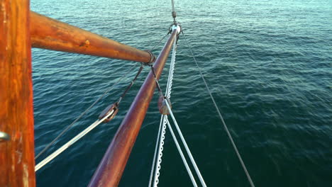 medium shot of a bowsprit on green water