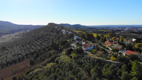 drone shot of some buildings on the ridge in palmela, portugal