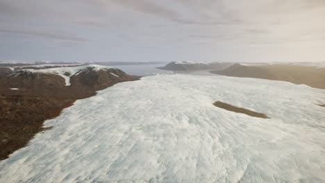 aerial view of a vast glacier in a snowy mountain range