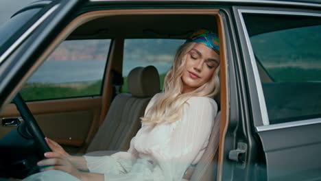 woman driving a vintage car