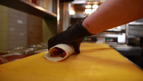 chef preparing a wrap