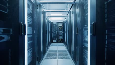 this footage showcases the interior of a data center featuring rows of racks filled with servers, cables, and innovative technology. the bright lighting highlights the advanced infrastructure.