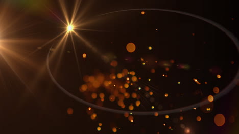 chispas de luz anaranjadas brillantes y manchas de luz contra un fondo negro
