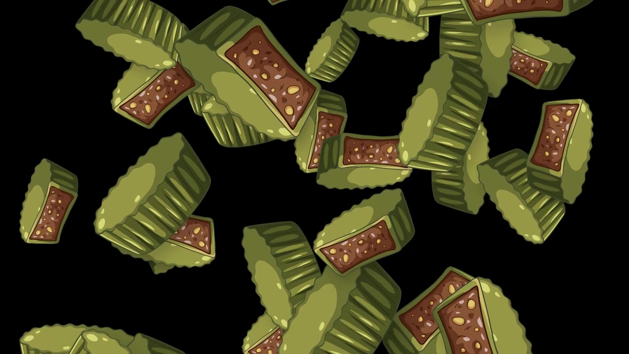 Matcha green tea chocolates with nut filling fall through frame against a black background.