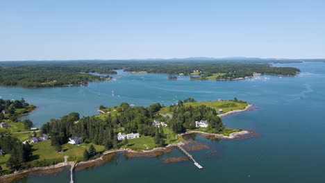 scenic coastline in penobscot bay, maine | mid-day aerial panning view | summer 2021