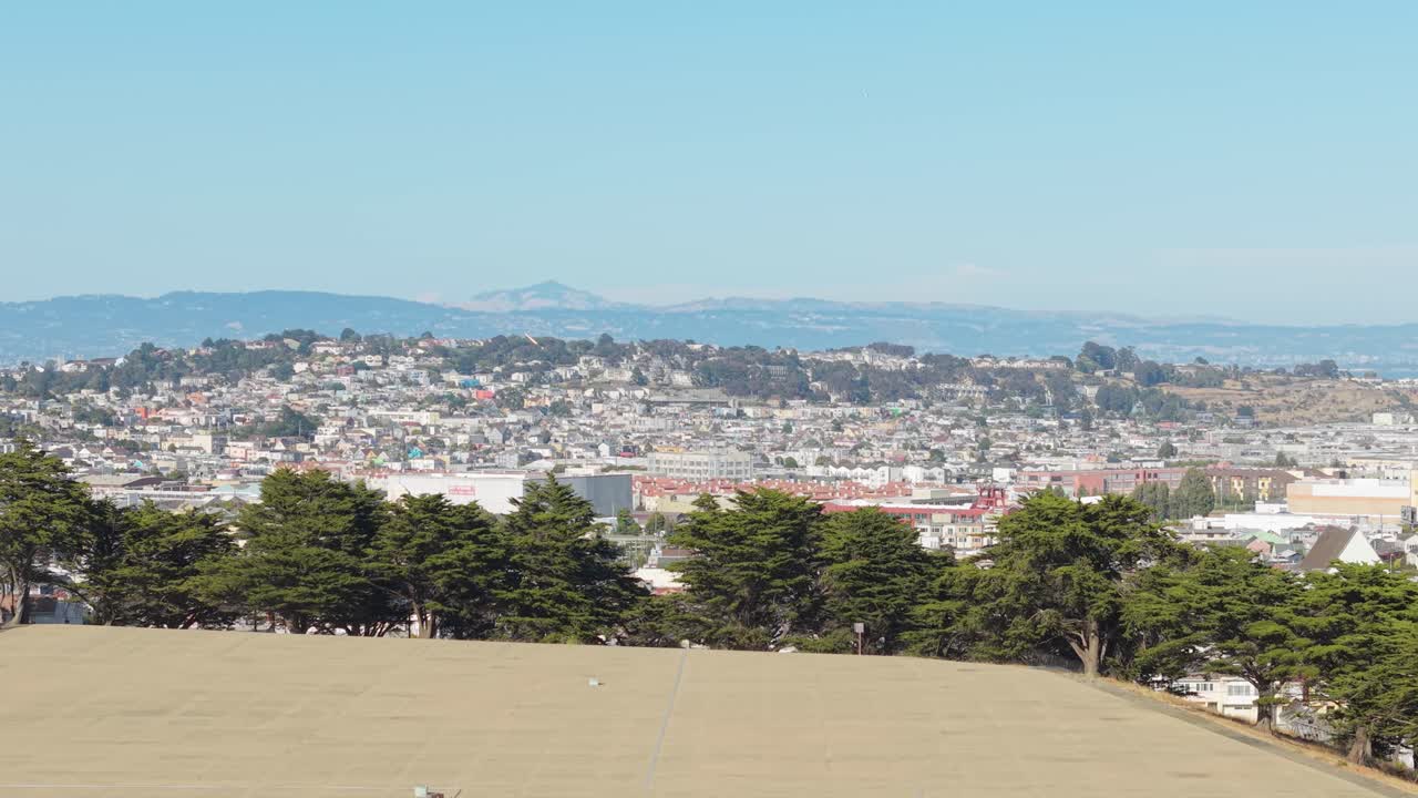 A wide look at Bernal Heights captures its quiet streets against the buzz of surrounding San Francisco