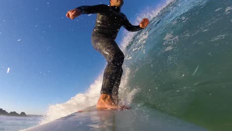 View-of-some-strong-rider-generating-some-speed-in-Praia-do-Guincho,-Cascais,-Portugal-2