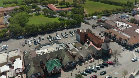 Aerial-view-over-the-store-fronts-and-windmill-in-Solvang,-California