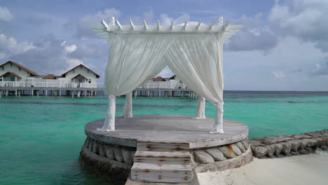 white arch with tropical beach and sea in maldives