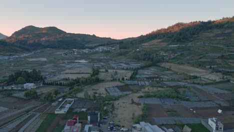 Aerial-flyover-ARJUNA-TEMPLE-at-Dieng-Plateau-in-Central-Java-during-sunrise,-Indonesia