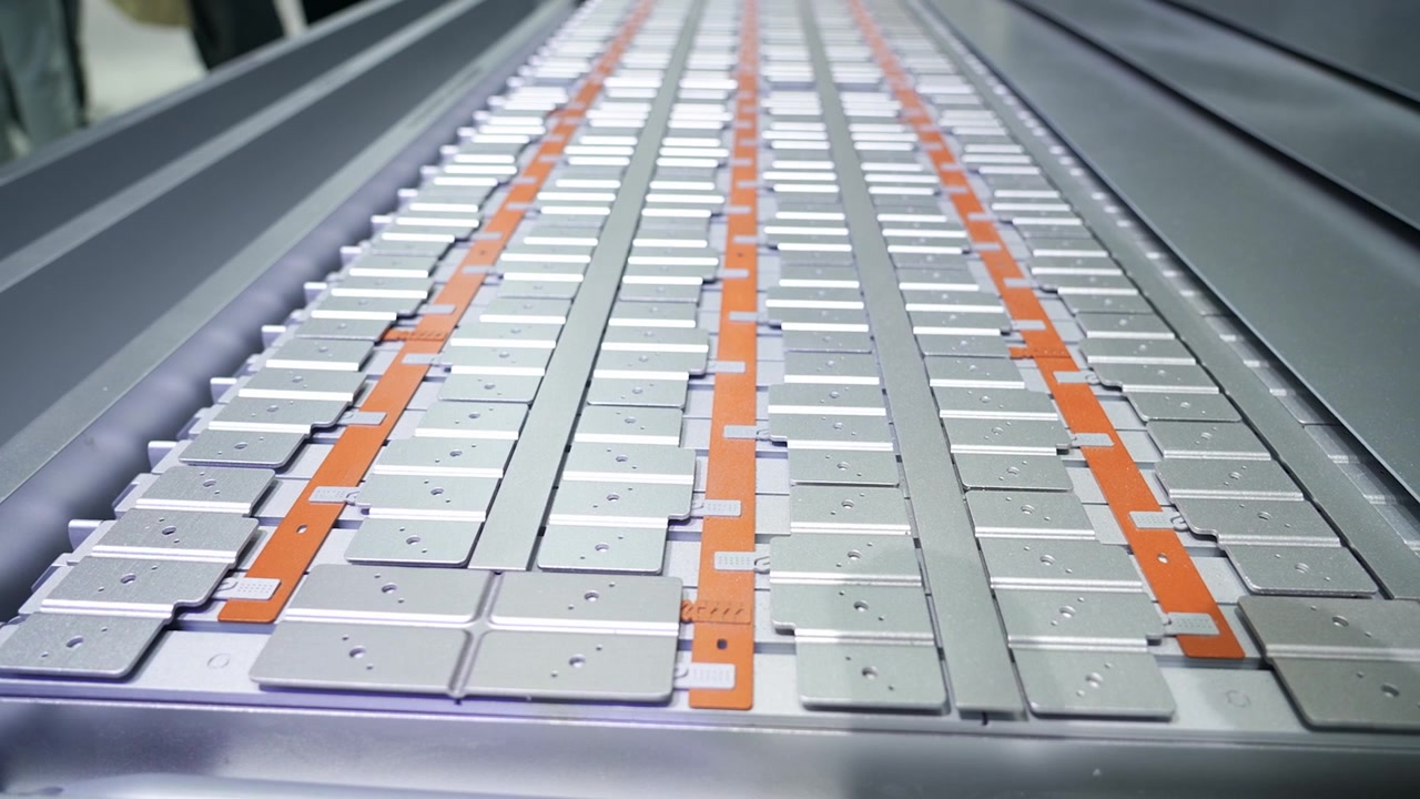 Close-up of CATL prismatic battery cells arranged in an EV battery pack, showcasing electric vehicle technology, energy storage systems, and modern industrial manufacturing.