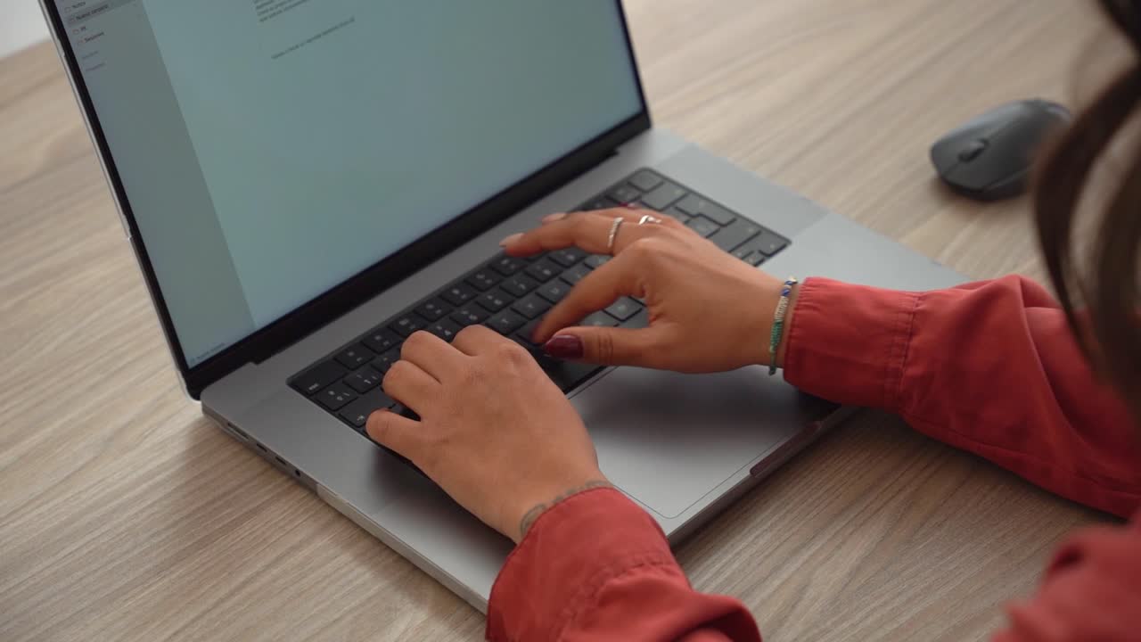 Woman typing on laptop keyboard montage