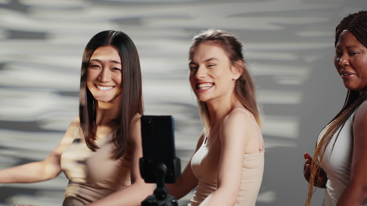 Three diverse women taking a selfie
