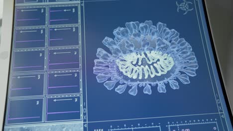 detailed coronavirus model on computer screen. futuristic laboratory research. close up on screen