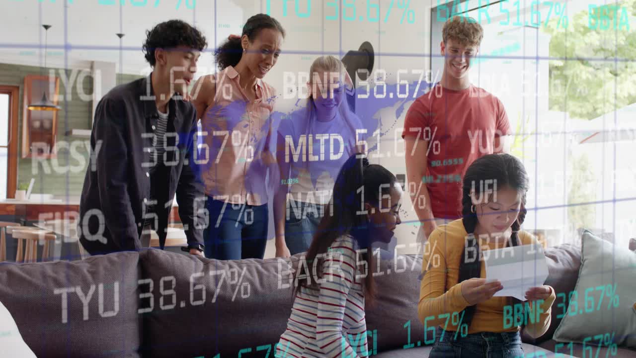 Seated woman showing tablet, group cheering finance win while ticker overlay scrolling across scene