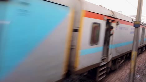 passenger-train-running-on-track-crossing-each-other-from-opposite-direction-at-morning-video-is-taken-at-new-delhi-railway-station-on-Aug-04-2022