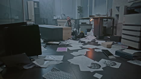 stressed man in a disorganized office