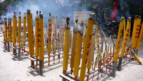 Buddist-candles-burning-in-the-day-at-a-temple