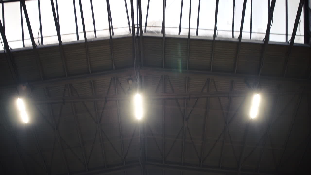 Industrial Building Interior with Skylights and Lights