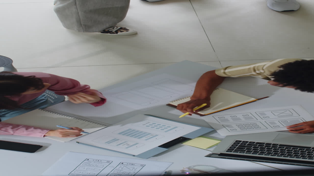 Vertical of Multiethnic Team Meeting in Office Top View