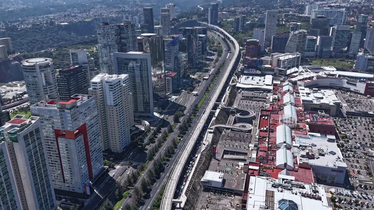 Accelerated aerial footage capturing Santa Fe area with interurban train in service, CDMX