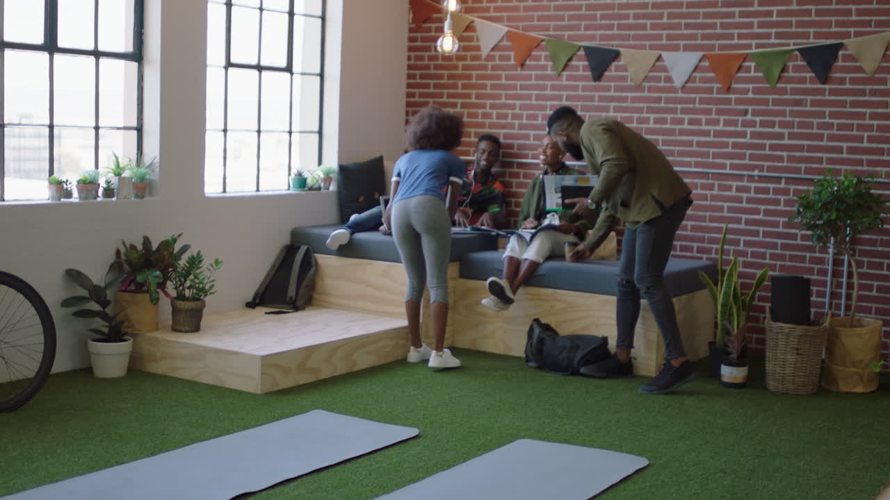 african american business students meeting brainstorming working together on project sharing ideas in modern office workplace