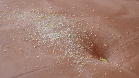 close up of a dirty brown sofa