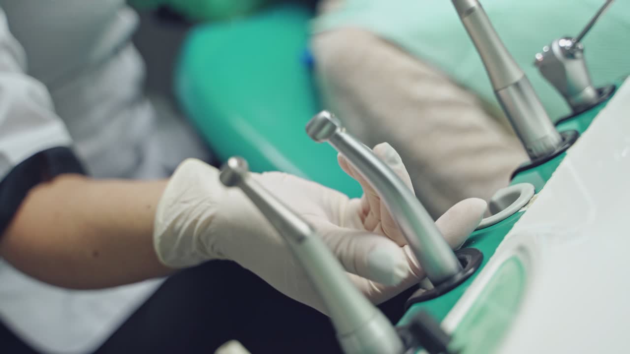 Dentist and patient in dentist office. Dental clinic.