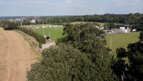 aerial rising reveal of canterbury rugby club complex grounds