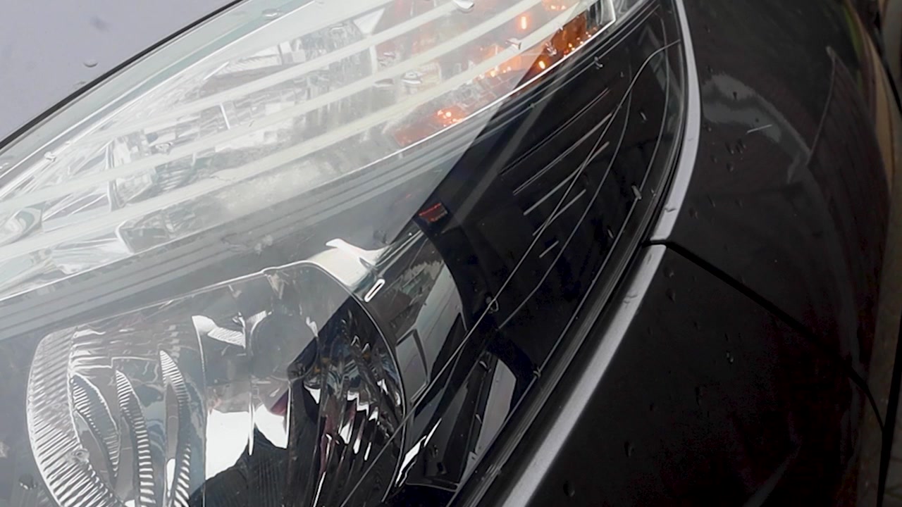 Video using lights and blinker on car.