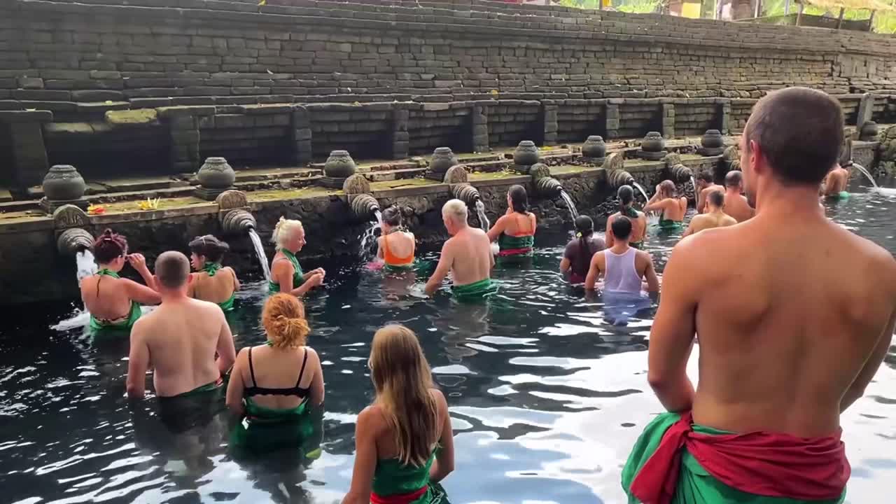 Tirta Empul Temple with Tourists Bathing in Holy Water in Bali, Indonesia.