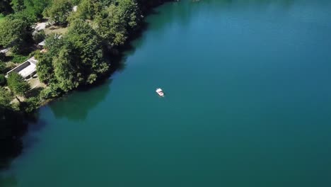 view-of-a-small-boat-at-Monticchio's-lakes-from-a-drone