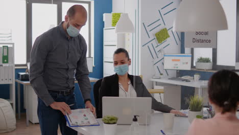 bussines team with medical face mask working at marketing project