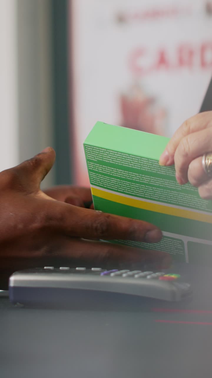 Vertical video: Clients buying pharmaceutical products at cash register desk