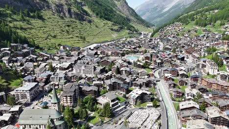 zermatt town in swizerland summer pull back drone aerial reverse reveal