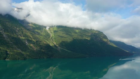 a flight over the mirrorlike turquoise waters of the loenvatnet lake