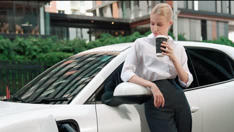 progressive businesswoman leaning on electric car and charging station.