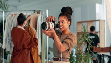 a fashion photographer in a studio taking photos of clothing