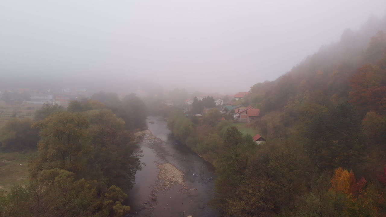 Misty autumnal River Bosna in Bosnia and Herzegovina, aerial
