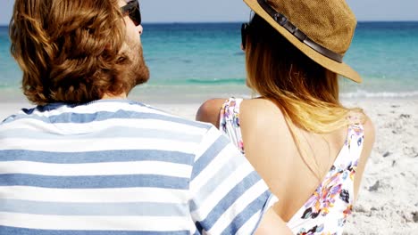 Couple-enjoying-together-at-beach