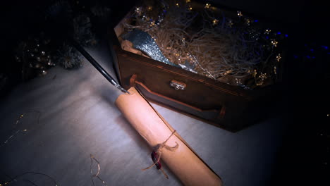 mysterious christmas gift box with a sealed scroll